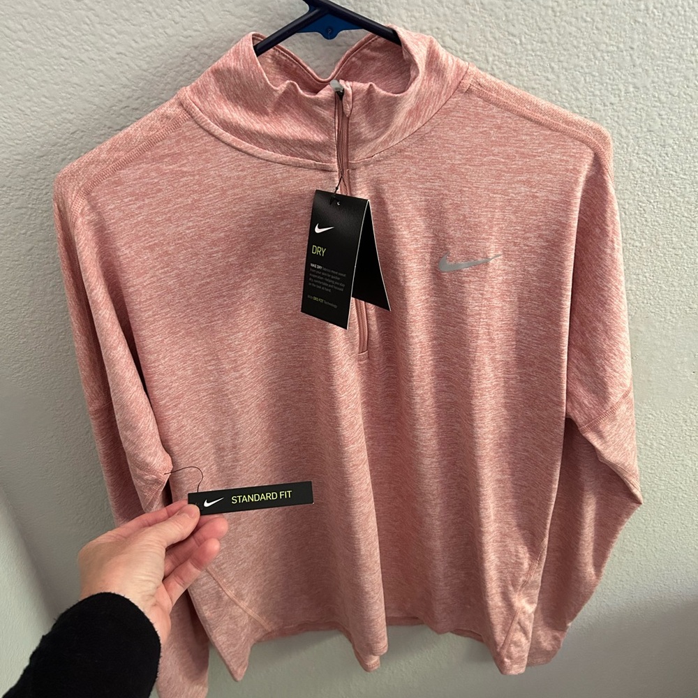 Nike Dry Fit running shirt, brand new with tags. Soft pink color. No flaws